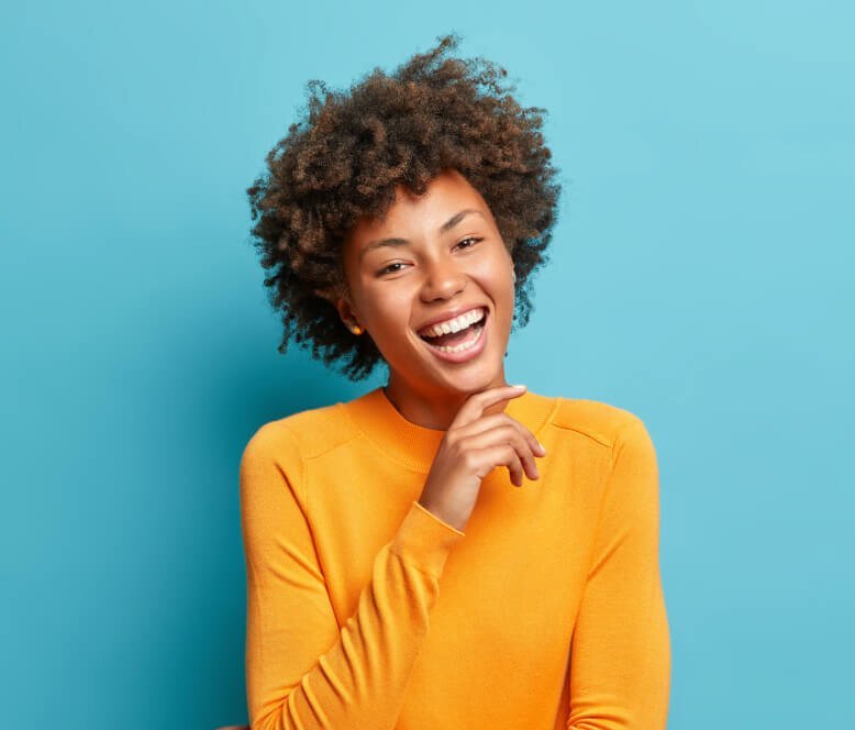 portrait of glad young afro american woman laughs 2021 08 31 09 15 33 utc 1.jpg